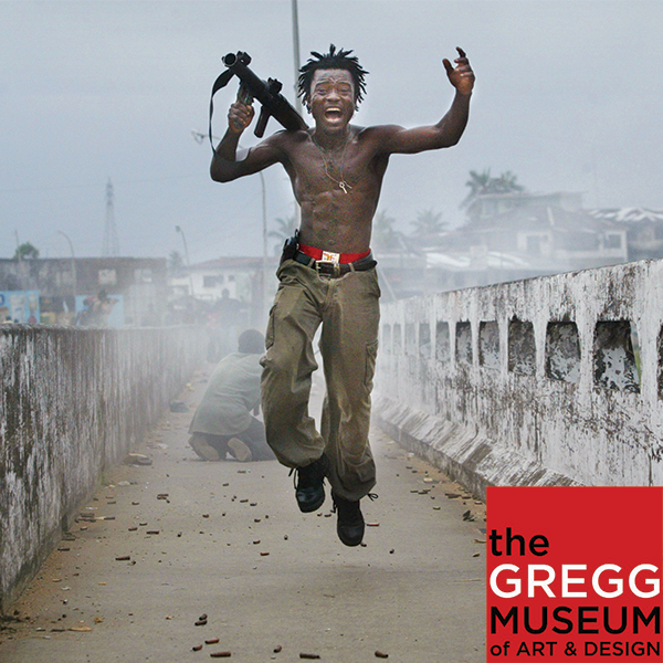 A photo of a jumping Liberian soldier by Chris Hondros. This image is a button to access a virtual tour.