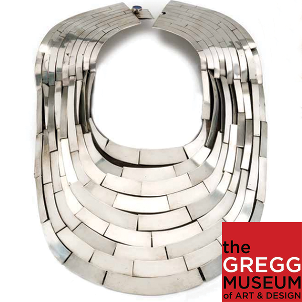 Image of a large silver necklace made by Mary Ann Scherr. The image is a button to a virtual tour.