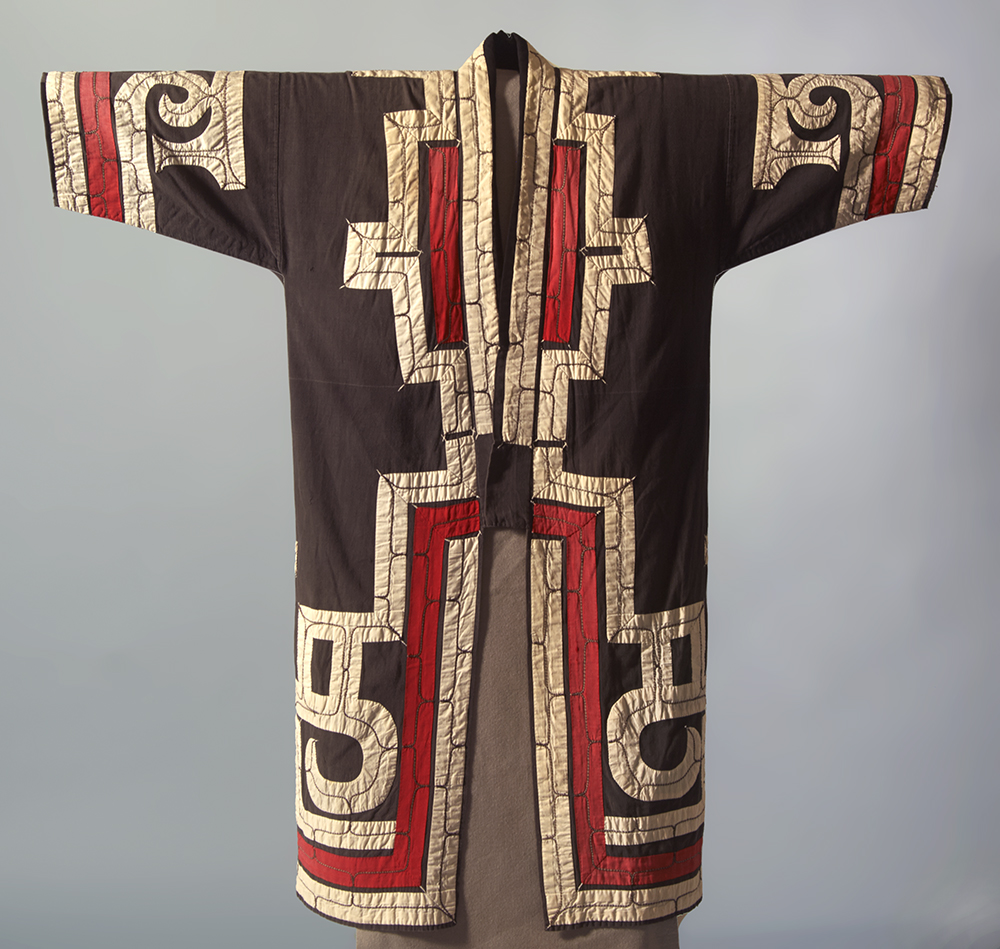black robe with appliqued white and red pattern